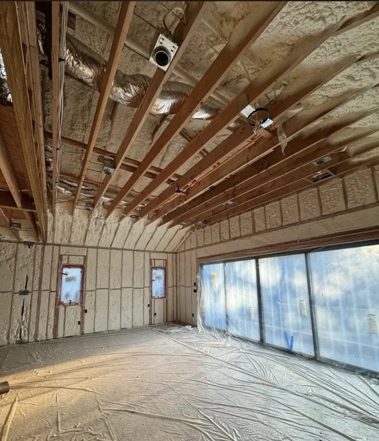 Interior walls and ceiling insulated with spray foam during new construction in Barton
